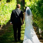 bride-and-groom-walking-in-vines