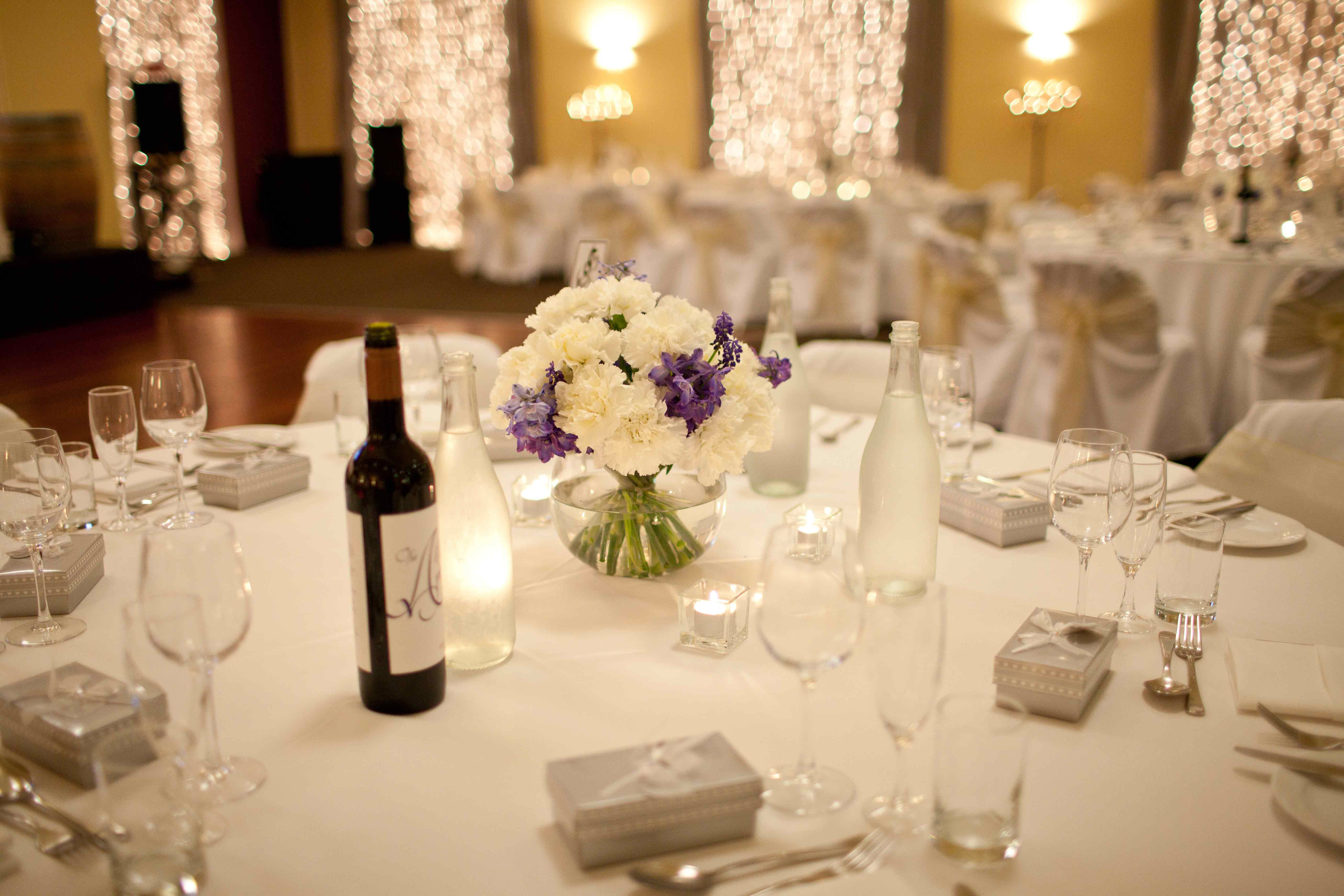 table-set-up-with-fairylights-behind