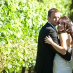 wedding-couple-looking-back-from-the-vines